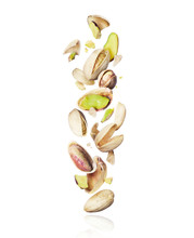Cracked Pistachios Fall Down On White Background