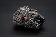 Piece Of Hubnerite Mineral From Pasto Bueno, Peru. A Mineral Consisting Of Manganese Tungsten Oxide With Black Monoclinic Prismatic Submetallic Crystals With Fine Striations.