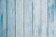 Texture of old blue paint on a wooden fence. Background for your design.