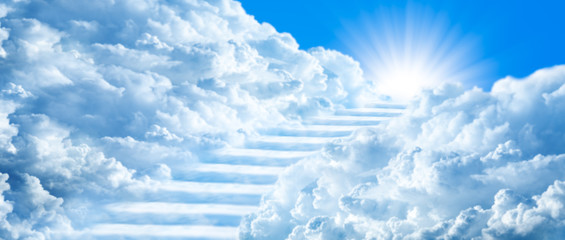 stairway curving through clouds into the light of heaven with blue sky