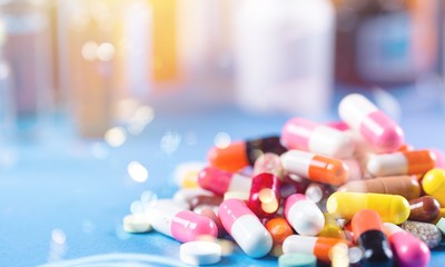 Sticker - Colorful pills and tablets on background