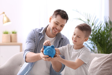 Poster - Family with piggy bank and money at home