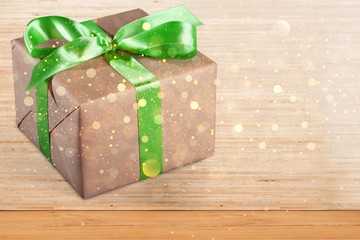 Wall Mural - Gift box with green ribbon isolated