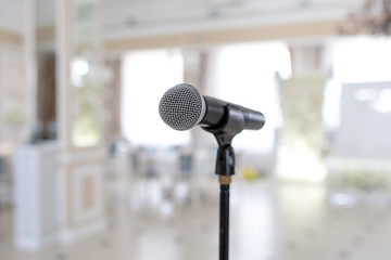 Microphone on the stand. Place to speak at the event. Holiday concept.