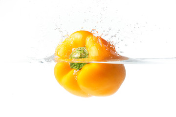 Wall Mural - Paprika pepper splashing into water