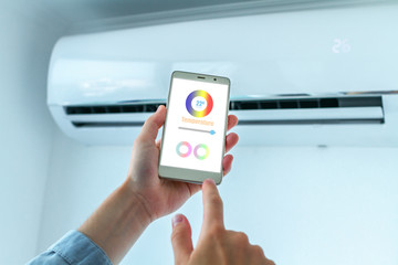 Mobile application on smartphone for adjusting the temperature on the air conditioner. Smart House