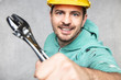 the construction worker holds the key in his hands, the key as a source of inspiration and ingenuity