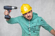 © marcinmaslowski - the construction worker holds an electric screwdriver in his hand, various situations