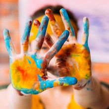 Modern Fine Art Course. Closeup Of Female Hands Dirty With Colorful Paint. Blur Background.