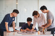 © Songsak C - Startup concept, Team of young business meeting on office workplace.