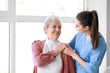 © Pixel-Shot - Medical worker with senior woman in nursing home