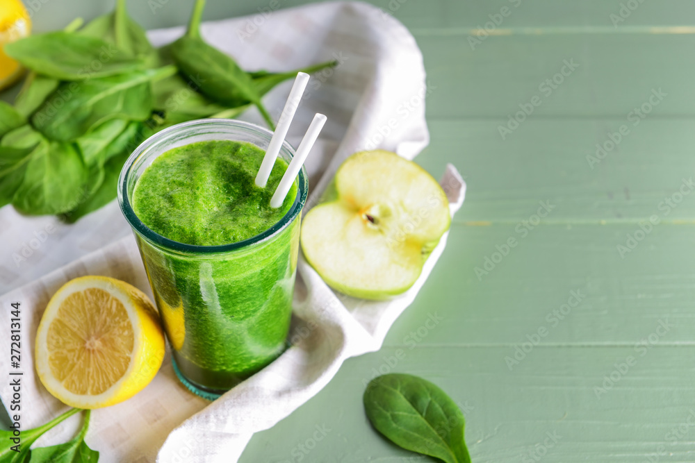 Glass of fresh smoothie on wooden table