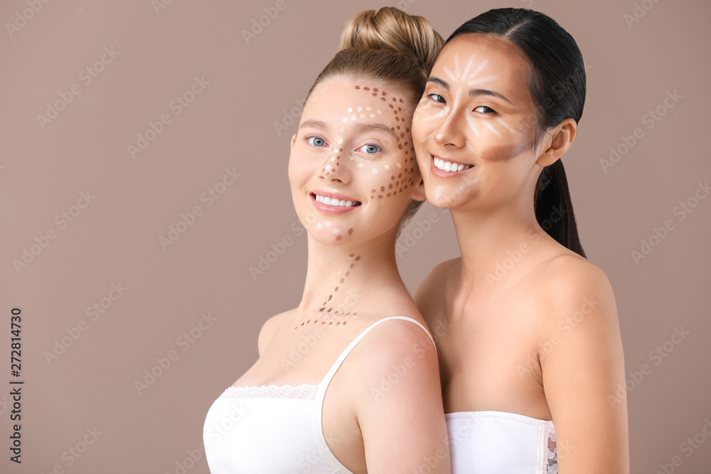 Young women with contouring makeup on color background