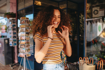 Wall Mural - Cheerful curly hair girl