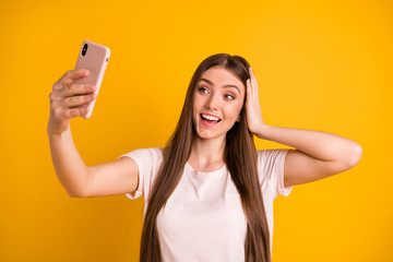 Canvas Print - Close up photo beautiful amazing she her lady very long hairstyle hold hands arms telephone make take selfies speak tell skype friends wear casual pastel t-shirt isolated yellow bright background