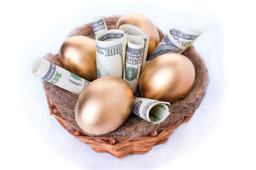 Wall Mural - Nest with golden eggs on a white background. Golden Eggs in Nest with of Dollars