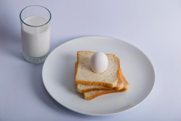 Closeup bread milk glass top egg