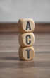 © Stockwerk-Fotodesign - Cubes and dice with acronym ACT