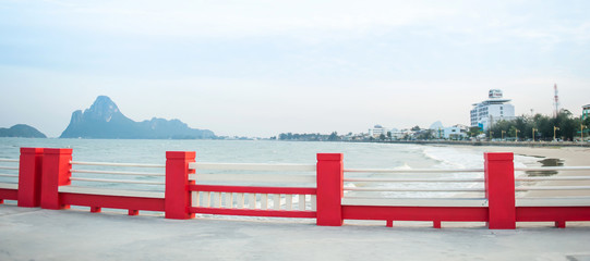 Poster - Empty red terrace sea view at dusk.