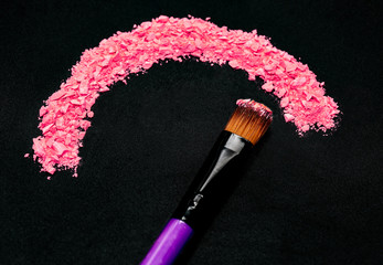 Professional make-up brush on rainbow crushed eyeshadow