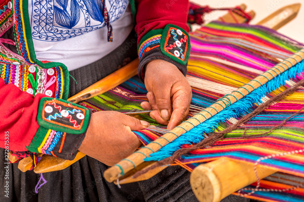 Peruvian woman working on traditional handmade wool production - obrazy, fototapety, plakaty 