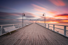 Wooden Pier In Gdynia Orlowo In The Morning With Colors Of Sunrise. Poland. Europe.