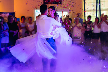 Wall Mural - newlyweds wedding dance. around the newlyweds decorative smoke,