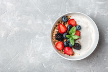 Healthy Breakfast With Granola, Yogurt, Fruits, Berries On White Background.