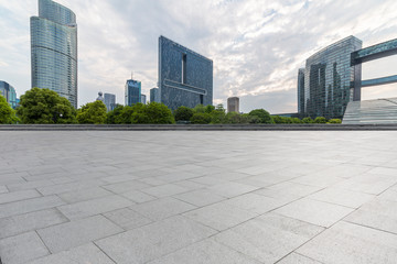 Panoramic skyline and modern business office buildings with empty road,empty concrete square floor