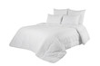 White coverlet or bedspread with four pillows isolated. White bedlinen on the bed.