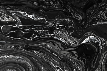 Abstract black marble texture background. Oil, acrylic paint mix pattern.