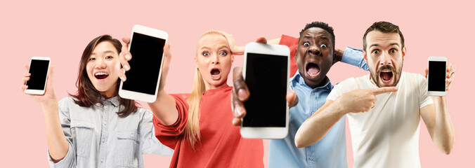 Portrait of people showing mobile phones isolated over coral background. Male and female models using smartphone for talks, chating, betting or online bill payments. Creative collage made of 4 people.