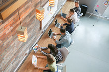 Young people having business meeting in modern office