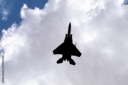 Silhouette of F-35 aircraft fly on blue sky and clouds background Tableau sur Toile