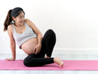 © nuiiko - Asian pregnant woman doing yoga at home, lifestyle concept.