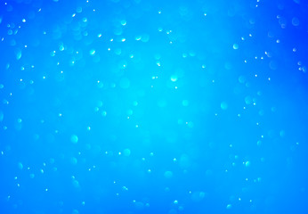 Wall Mural - Bokeh background and bubbles reflecting blue sea light