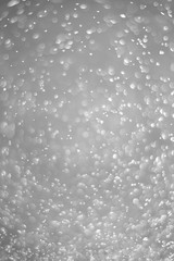 Wall Mural - Bokeh background and bubbles reflecting black and white light