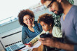 © Mediteraneo - Mother and father helping daughter to do homework learning to calculate