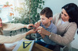 © Mediteraneo - Smiling deaf boy learning sign language. Selective focus.