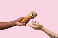 Male Hand Holding A Waffle Cone With Ice Cream.