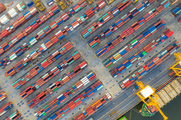 Wall Mural - Aerial top view container cargo ship working. Business import export logistic and transportation of International by ship in the open sea.