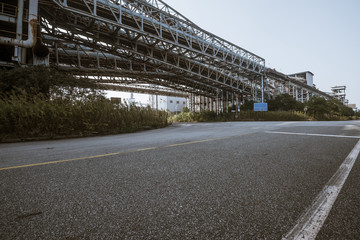 Wall Mural - Asphalt concrete flooring and factory buildings