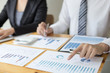 © Puwasit Inyavileart - Managers and accountants have checked the company's finances. In order to prepare the performance measurement for the past 5 years to prepare and evaluate the development of the organization
