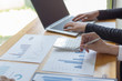 © Puwasit Inyavileart - Managers and accountants have checked the company's finances. In order to prepare the performance measurement for the past 5 years to prepare and evaluate the development of the organization