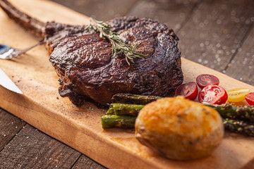 Bone-in Tomahawk Ribeye Steak meal angled