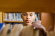 © Samuel B. - Black african american young girl student studying at the school university library