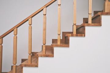 Contemporary brown wooden stairs in the house