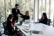 © P Stock - Businessmen meeting and agreeing by holding hands in the meeting room.