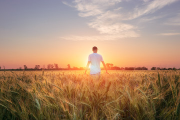 photographer while working search for a story / evening landscape man on the field