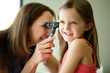 © Natalie Faye - Young girl having an ear exam